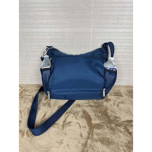 Travel on antitheft classic Crossbody bucket bag navy blue new without tags 
￼ - Picture 4 of 10